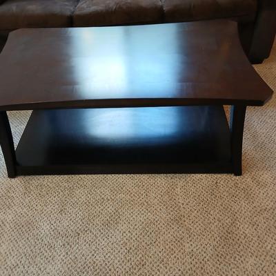 Two tone finish round coffee table on casters - easy to move!