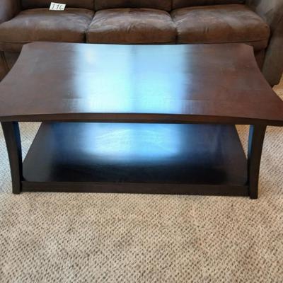 Two tone finish round coffee table on casters - easy to move!