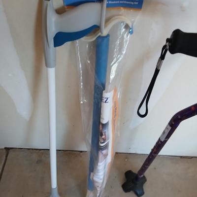 Adjustable Nova metal cane, Reacher -grabbing tool, and Dress-Ez assist with dressing tool