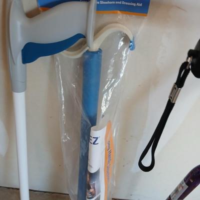 Adjustable Nova metal cane, Reacher -grabbing tool, and Dress-Ez assist with dressing tool