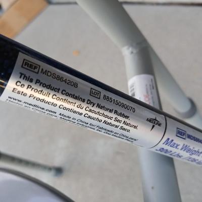 Mobility commode with an adjustable walking cane