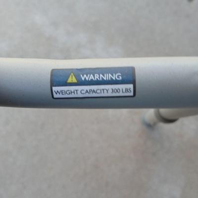 Mobility commode with an adjustable walking cane