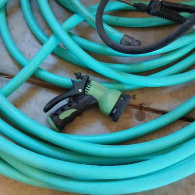 Nice garden hose with spray nozzles and a weed sprayer