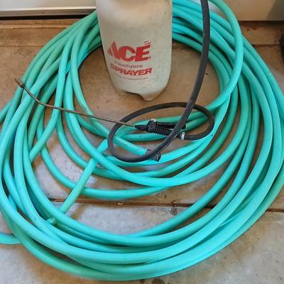 Nice garden hose with spray nozzles and a weed sprayer