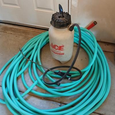 Nice garden hose with spray nozzles and a weed sprayer