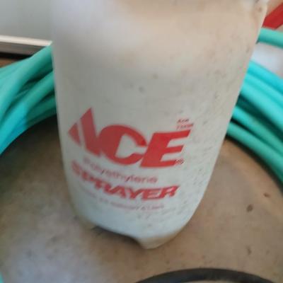 Nice garden hose with spray nozzles and a weed sprayer