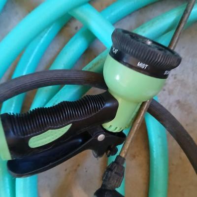 Nice garden hose with spray nozzles and a weed sprayer