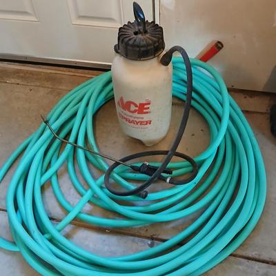 Nice garden hose with spray nozzles and a weed sprayer