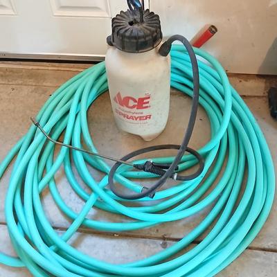 Nice garden hose with spray nozzles and a weed sprayer