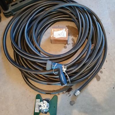 Nice garden hose with sprinkler and spray nozzle's