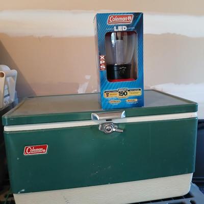 Vintage metal Coleman cooler with a Coleman classic LED lantern new in the box!