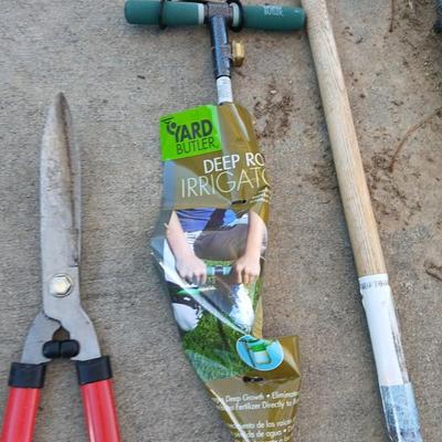 Yard and garden tools -whoppers - Trimmers - weed fork and a brand-new deep rod irrigation tool