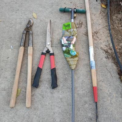 Yard and garden tools -whoppers - Trimmers - weed fork and a brand-new deep rod irrigation tool