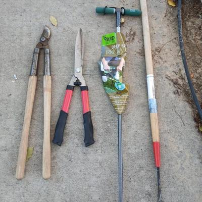 Yard and garden tools -whoppers - Trimmers - weed fork and a brand-new deep rod irrigation tool