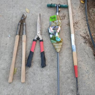 Yard and garden tools -whoppers - Trimmers - weed fork and a brand-new deep rod irrigation tool