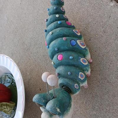 Handmade glass flower from plate and teacup and an adorable caterpillar that wants to frolic in your garden!