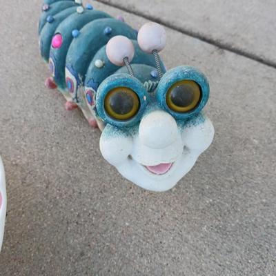 Handmade glass flower from plate and teacup and an adorable caterpillar that wants to frolic in your garden!