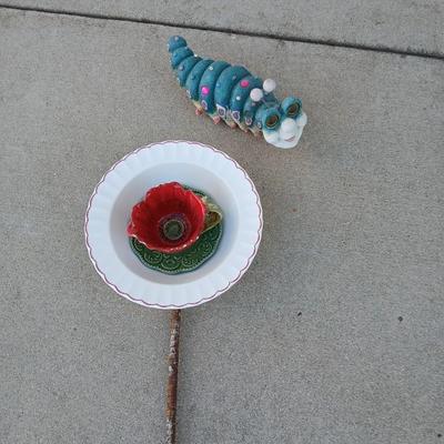Handmade glass flower from plate and teacup and an adorable caterpillar that wants to frolic in your garden!