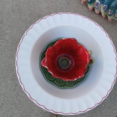 Handmade glass flower from plate and teacup and an adorable caterpillar that wants to frolic in your garden!