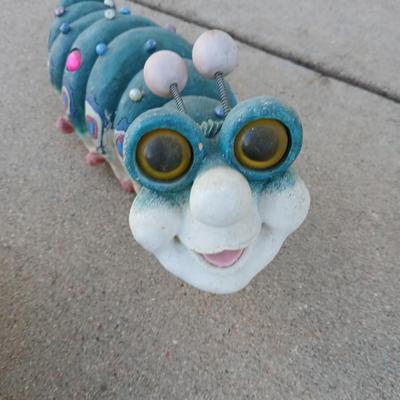 Handmade glass flower from plate and teacup and an adorable caterpillar that wants to frolic in your garden!