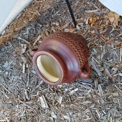 Pottery pot for plants, and a shepherd hook