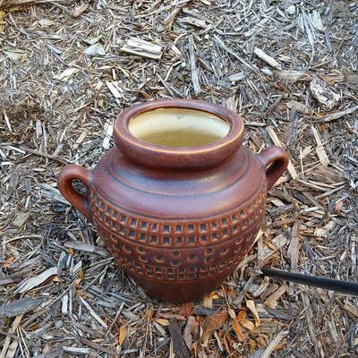 Pottery pot for plants, and a shepherd hook