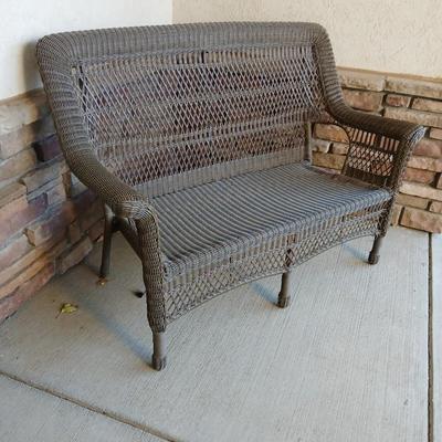 Plastic Wicker like patio bench with nice Welcome mat