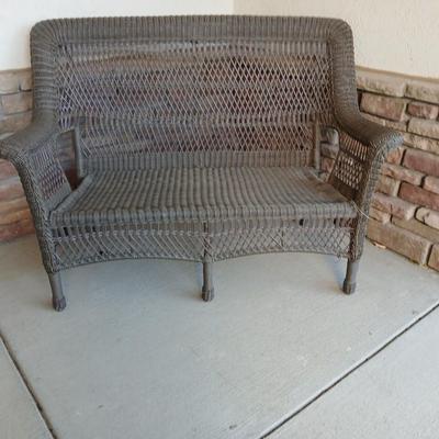 Plastic Wicker like patio bench with nice Welcome mat