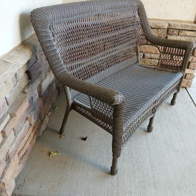 Plastic Wicker like patio bench with nice Welcome mat