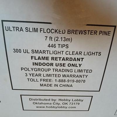 7 foot Ultra slim flocked Brewster pine tree with snowman tree skirt 300 Smart light clear lights