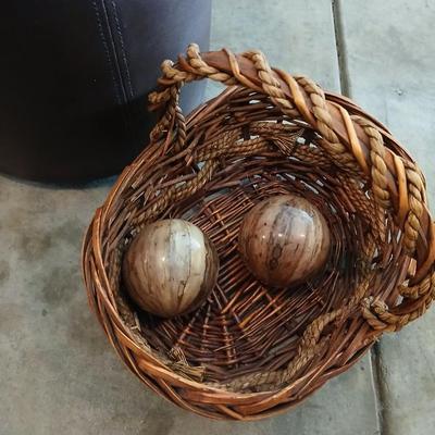 Footstool - wicker basket with balls and a tall vase