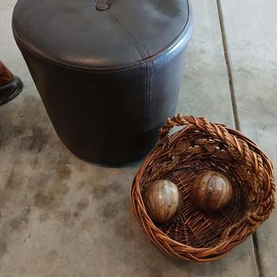 Footstool - wicker basket with balls and a tall vase