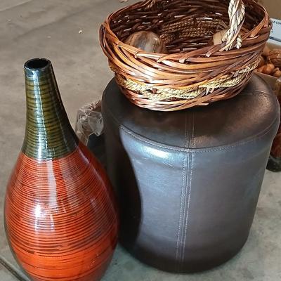 Footstool - wicker basket with balls and a tall vase