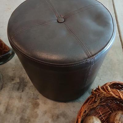 Footstool - wicker basket with balls and a tall vase