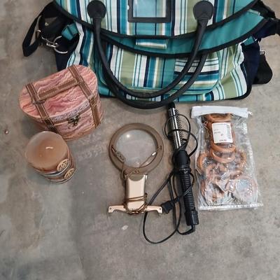 Savy caddy bag carry on size with curling iron, candle, decorative box, magnifier, and more