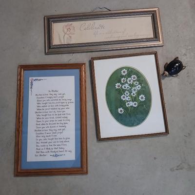 Three framed wall art and a small turtle figure