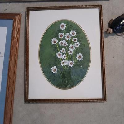 Three framed wall art and a small turtle figure