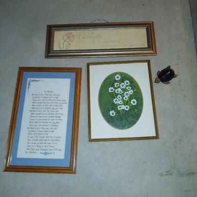 Three framed wall art and a small turtle figure