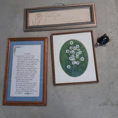 Three framed wall art and a small turtle figure