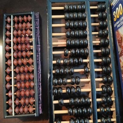 Four puzzles two are new with two Abacus