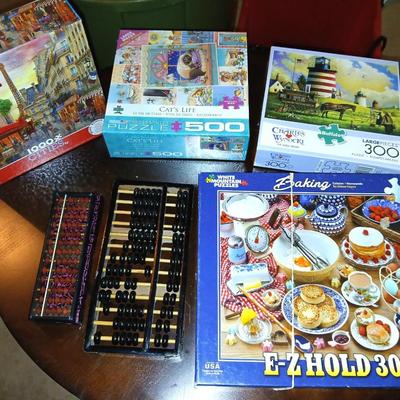 Four puzzles two are new with two Abacus