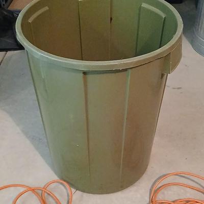 Large green trash can with extension cords