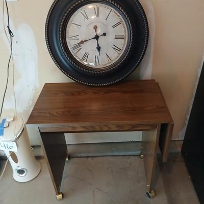 Drop leaf table on casters with Large Edinburgh Clock works co. wall clock