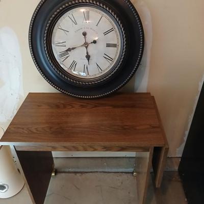 Drop leaf table on casters with Large Edinburgh Clock works co. wall clock
