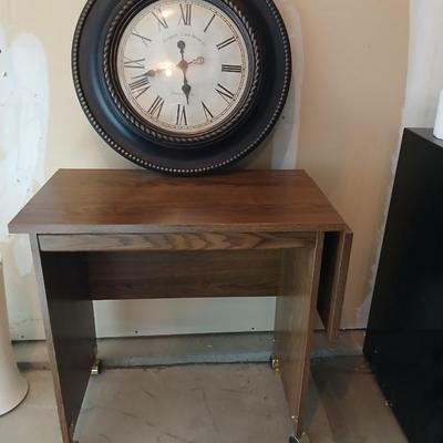 Drop leaf table on casters with Large Edinburgh Clock works co. wall clock