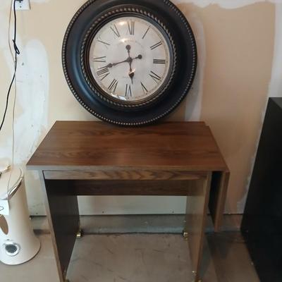 Drop leaf table on casters with Large Edinburgh Clock works co. wall clock