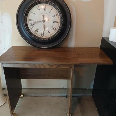 Drop leaf table on casters with Large Edinburgh Clock works co. wall clock