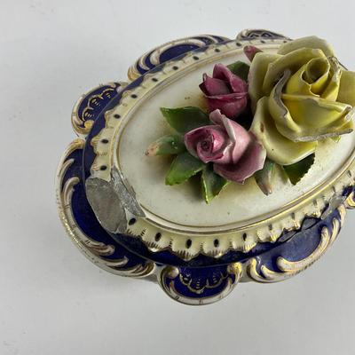 Sale Photo Thumbnail #1266: Rose lid trinket box has minor chipping damage on lid