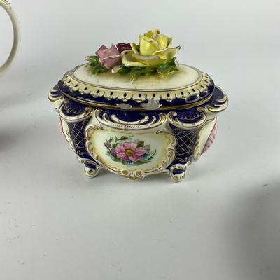 Sale Photo Thumbnail #1270: Rose lid trinket box has minor chipping damage on lid