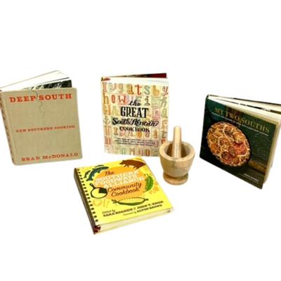 Sale Photo Thumbnail #230: Celebrate Southern cuisine with this collection of four cookbooks and a wooden mortar and pestle. This set provides recipes and stories that capture the essence of Southern hospitality and culinary tradition. From classic recipes to innovative takes on So